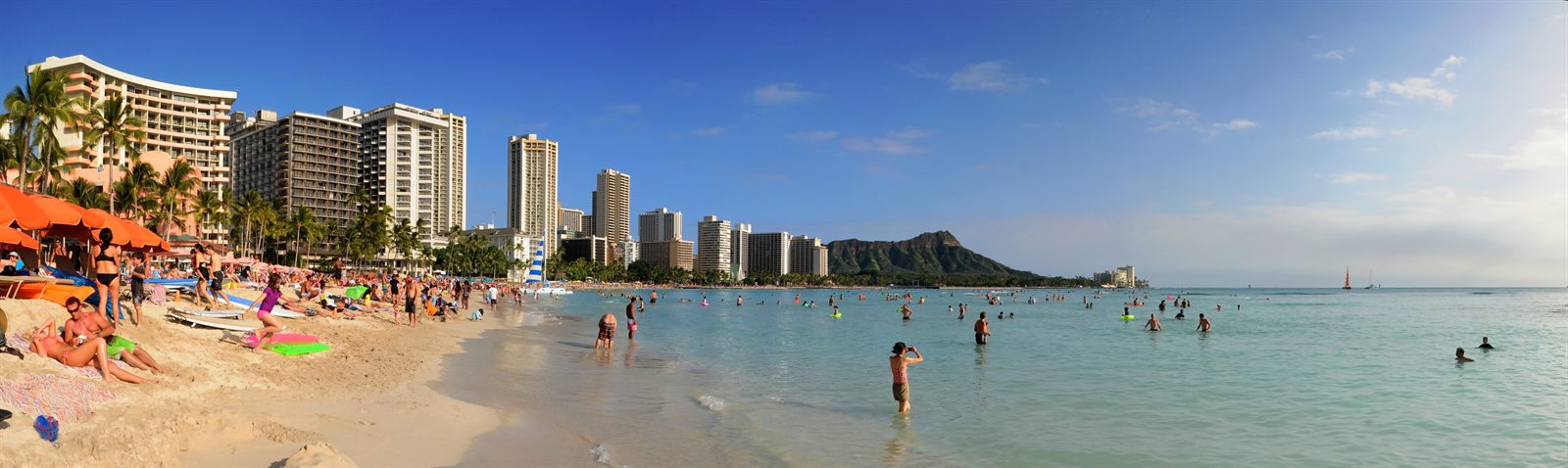 Waikiki Beach and its hotels with Diamond Head behind, a short drive from a lei greeting at Honolulu airport